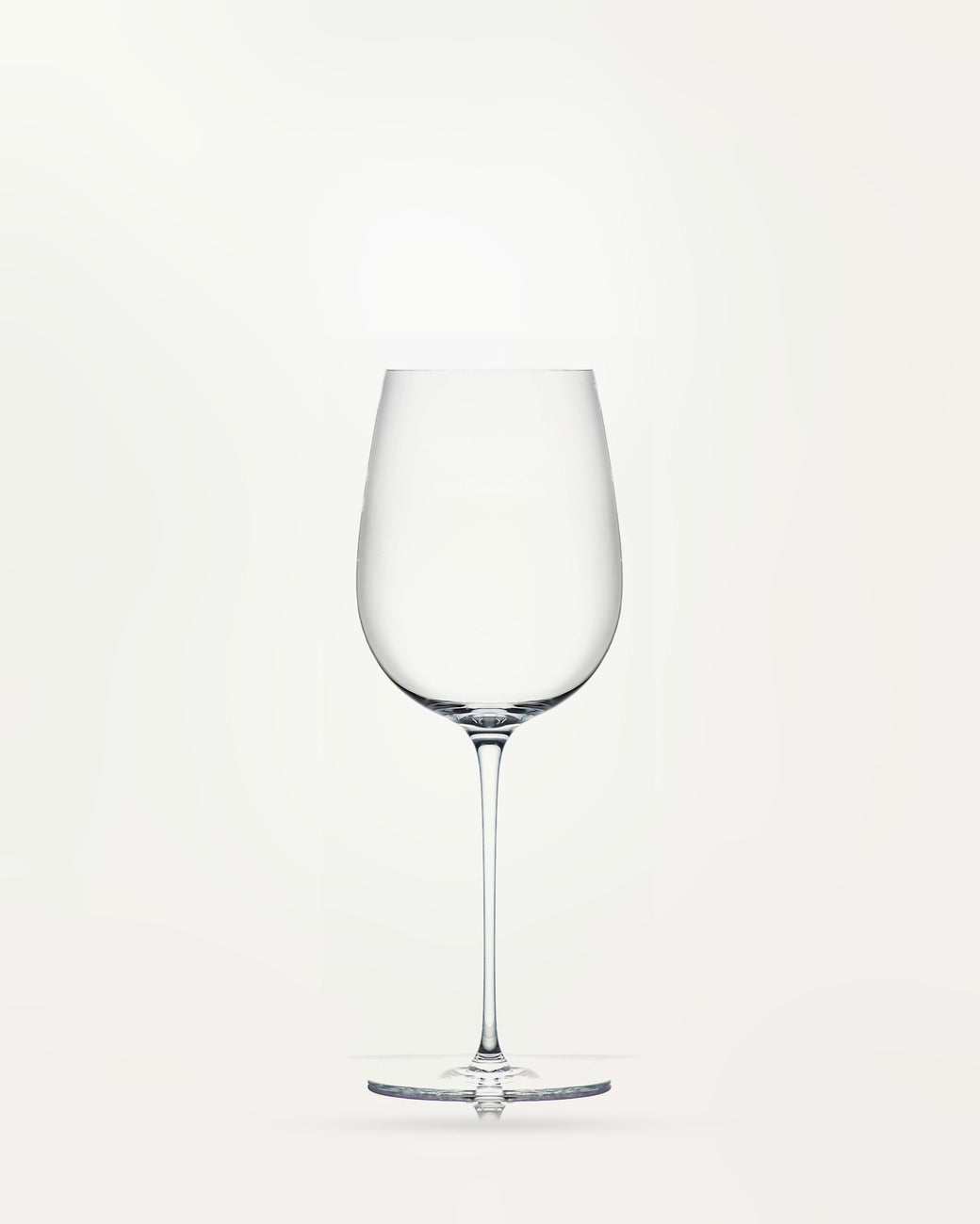 l'Esthète wine glass, empty, on a light background