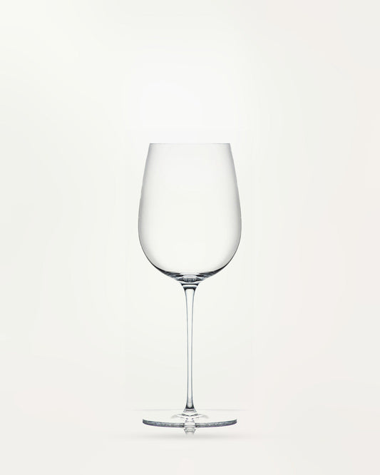 l'Esthète wine glass, empty, on a light background